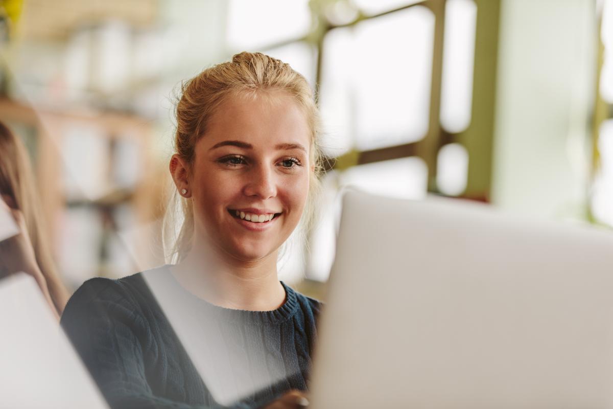 teen girl looks at her laptop and learns about mental health